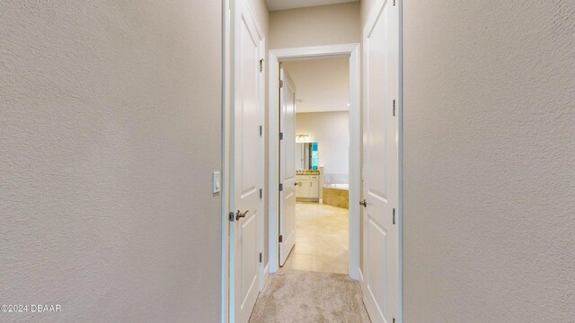 bathroom with vanity, tile patterned floors, and plus walk in shower