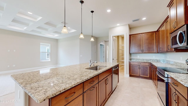 kitchen featuring sink, appliances with stainless steel finishes, coffered ceiling, an island with sink, and decorative light fixtures