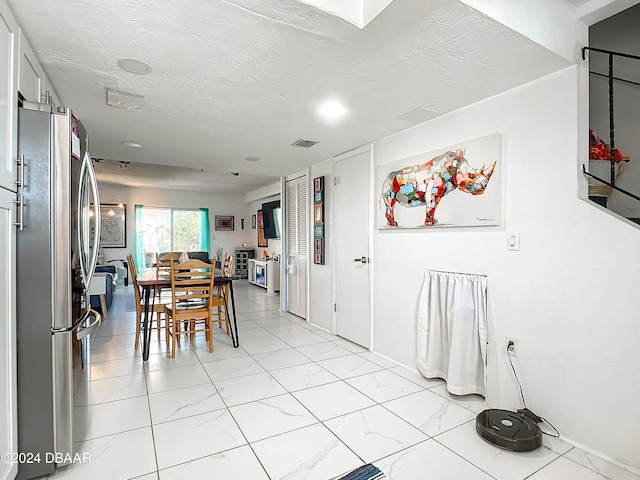 dining area with a textured ceiling