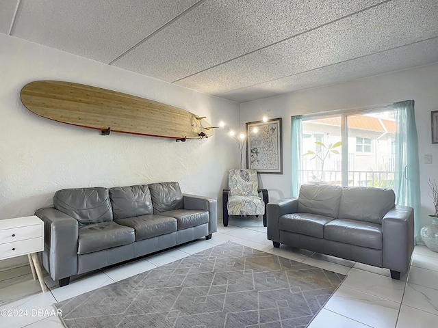 1510 Ocean Shore Blvd Unit 406, Ormond Beach, FL 32176 - living room featuring tile patterned floors and a textured ceiling
