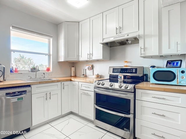 kitchen with stainless steel appliances and white cabinets