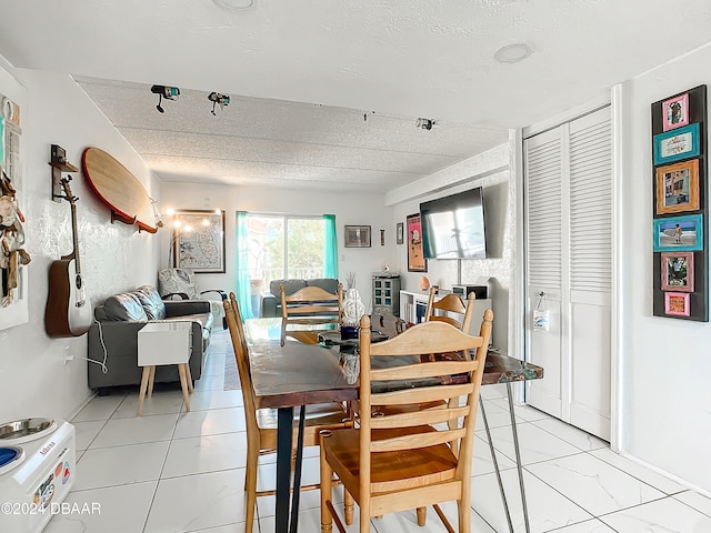 dining room with a textured ceiling