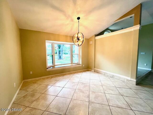 unfurnished living room featuring ceiling fan, light tile patterned floors, and a brick fireplace