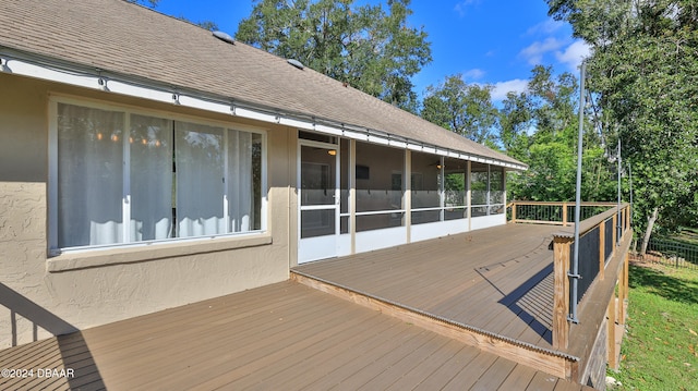 wooden terrace featuring a sunroom