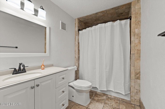 full bathroom featuring vanity, a textured ceiling, toilet, and shower / bath combination with curtain