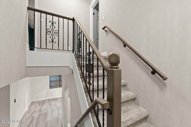 stairway featuring hardwood / wood-style floors