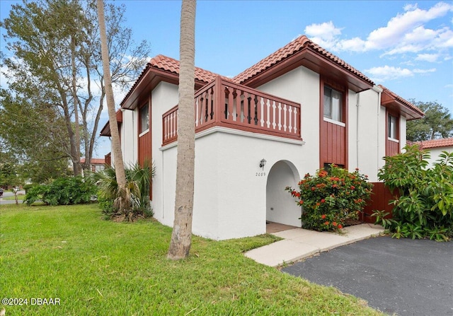 view of home's exterior with a yard