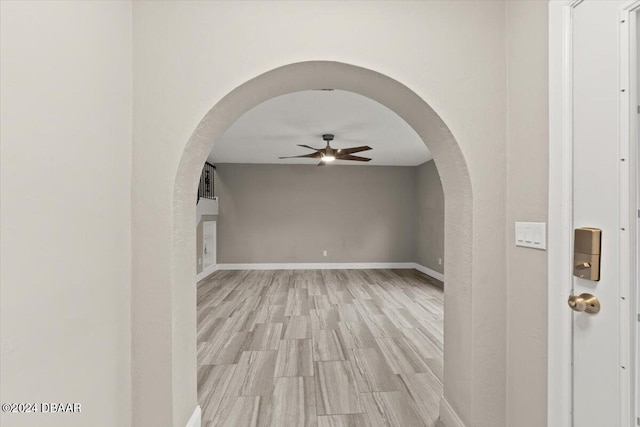 interior space featuring light hardwood / wood-style floors and ceiling fan