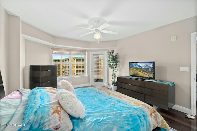 bedroom featuring ceiling fan and dark wood-type flooring