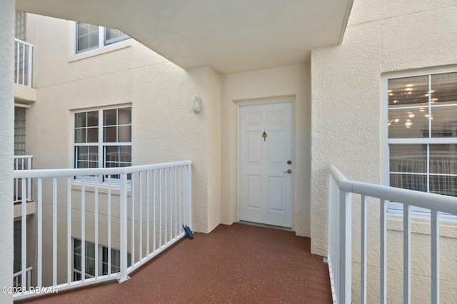 entrance to property featuring a balcony