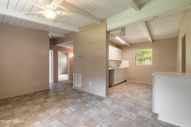 442 Dorothy Ave, Holly Hill, FL 32117 - kitchen featuring ceiling fan, light countertops, stone finish floors, tasteful backsplash, and a wooden ceiling with exposed beams
