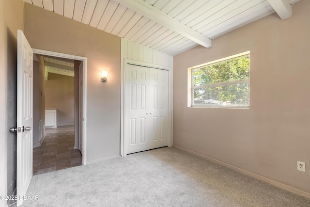 442 Dorothy Ave, Holly Hill, FL 32117 - unfurnished bedroom with carpet flooring, a closet, and a wooden ceiling with exposed beams