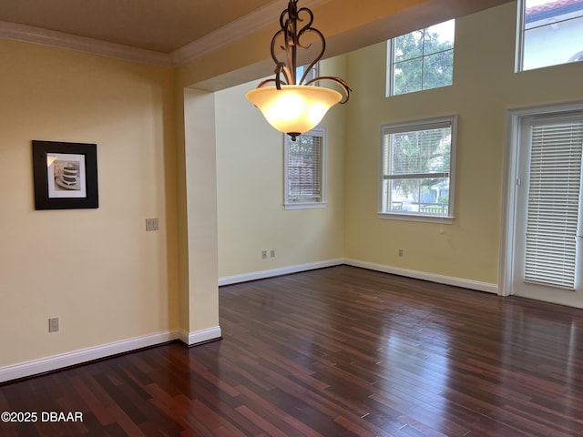 5090 Riverside Dr Unit 108, Port Orange, FL 32127 - unfurnished room featuring ornamental molding and dark wood-type flooring
