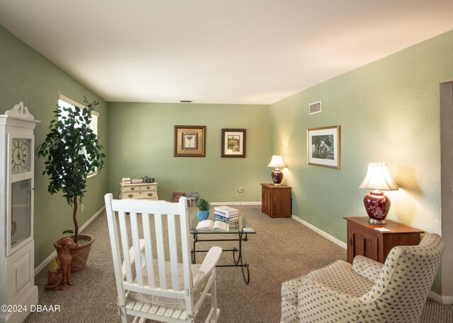 living room featuring light carpet