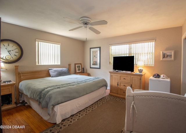 bedroom with light wood-type flooring and ceiling fan