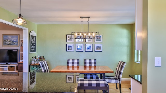 dining space featuring wood-type flooring