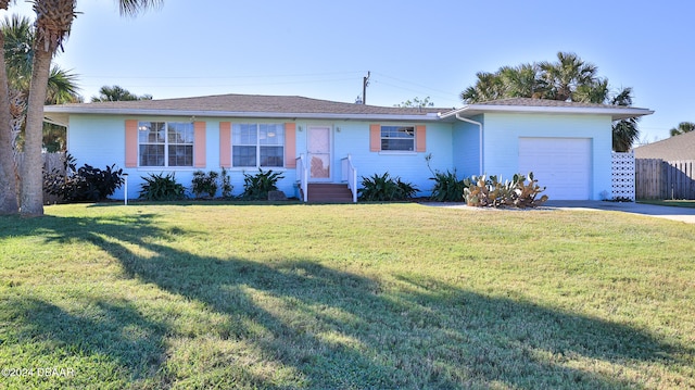 ranch-style home with a front yard and a garage