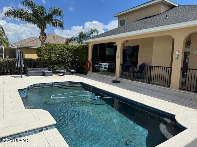 594 Marisol Dr, New Smyrna Beach, FL 32168 - view of pool with a patio area and fence