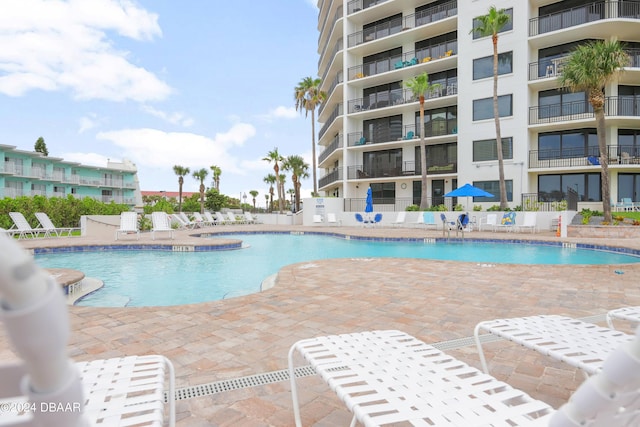 pool featuring a patio and fence