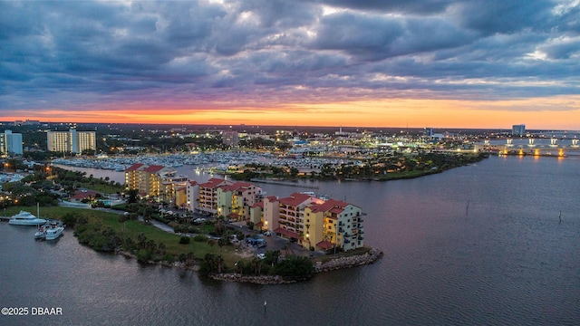 761 Marina Point Dr Unit 7610, Daytona Beach, FL 32114 - aerial view at dusk featuring a water view and a city view