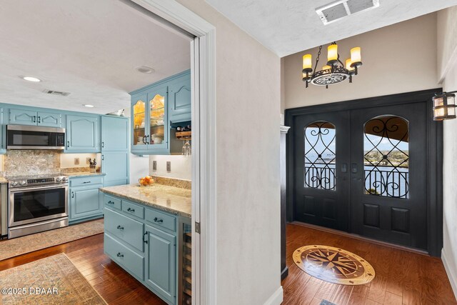 761 Marina Point Dr Unit 7610, Daytona Beach, FL 32114 - entrance foyer featuring dark wood-style flooring, visible vents, recessed lighting, and an inviting chandelier