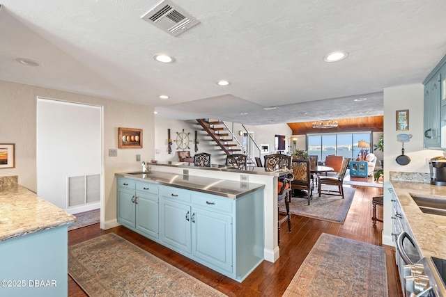 761 Marina Point Dr Unit 7610, Daytona Beach, FL 32114 - kitchen featuring recessed lighting, dark wood-type flooring, visible vents, and stainless steel countertops