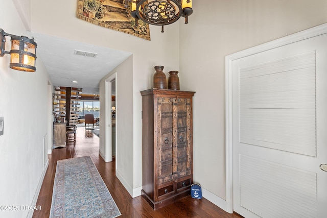 761 Marina Point Dr Unit 7610, Daytona Beach, FL 32114 - hallway with dark wood-style flooring, baseboards, and visible vents