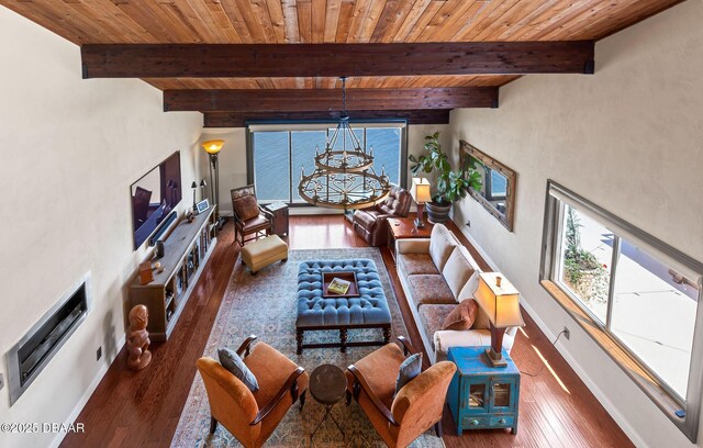 761 Marina Point Dr Unit 7610, Daytona Beach, FL 32114 - living room featuring beamed ceiling, wood ceiling, wood-type flooring, baseboards, and a notable chandelier