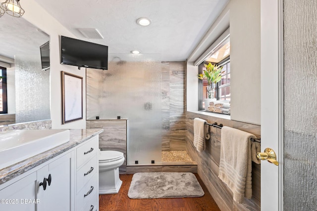 761 Marina Point Dr Unit 7610, Daytona Beach, FL 32114 - bathroom with toilet, wood finished floors, vanity, and walk in shower