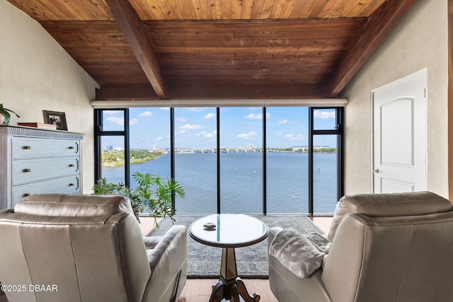 761 Marina Point Dr Unit 7610, Daytona Beach, FL 32114 - living room with a water view, a healthy amount of sunlight, wood ceiling, beamed ceiling, and wood finished floors