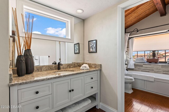 761 Marina Point Dr Unit 7610, Daytona Beach, FL 32114 - full bathroom featuring toilet, a wealth of natural light, a bathtub, vanity, and wood finished floors