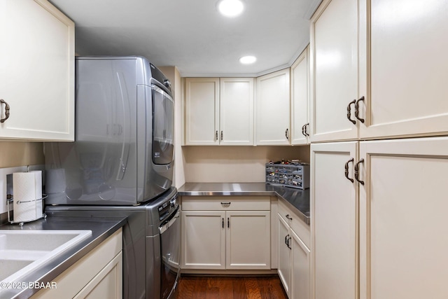 761 Marina Point Dr Unit 7610, Daytona Beach, FL 32114 - clothes washing area with cabinet space, recessed lighting, stacked washer / drying machine, and dark wood-style flooring