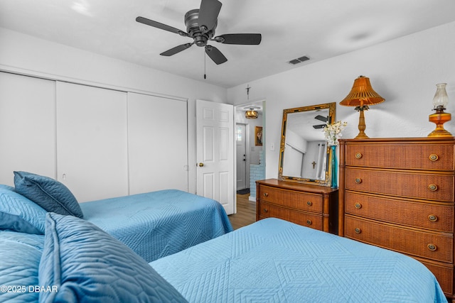 23 Briggs Dr, Ormond Beach, FL 32176 - bedroom with a closet, wood finished floors, and ceiling fan