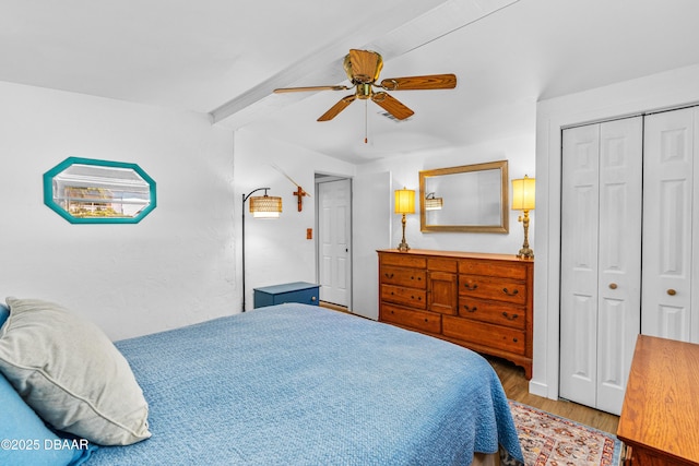23 Briggs Dr, Ormond Beach, FL 32176 - bedroom with beam ceiling, wood finished floors, a ceiling fan, and a closet