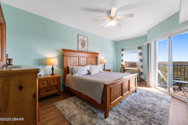 5300 S Atlantic Ave Unit 16-505, New Smyrna Beach, FL 32169 - bedroom with ceiling fan, access to exterior, and wood finished floors