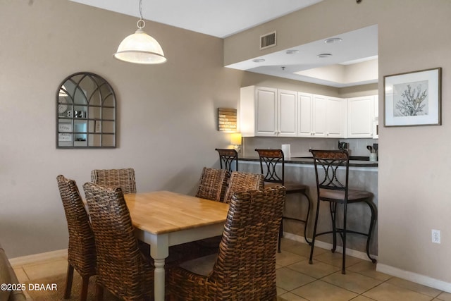 5300 S Atlantic Ave Unit 16-505, New Smyrna Beach, FL 32169 - dining space with baseboards, light tile patterned floors, and visible vents