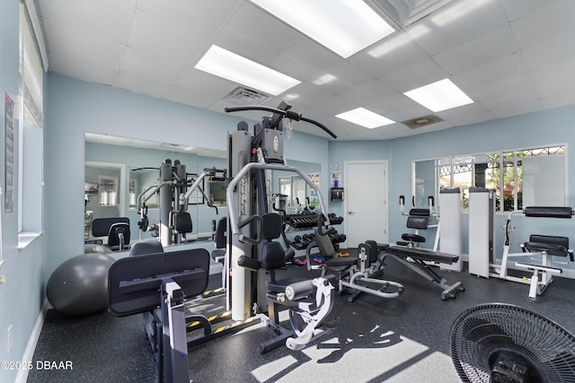 5300 S Atlantic Ave Unit 16-505, New Smyrna Beach, FL 32169 - exercise room with a paneled ceiling, baseboards, and visible vents