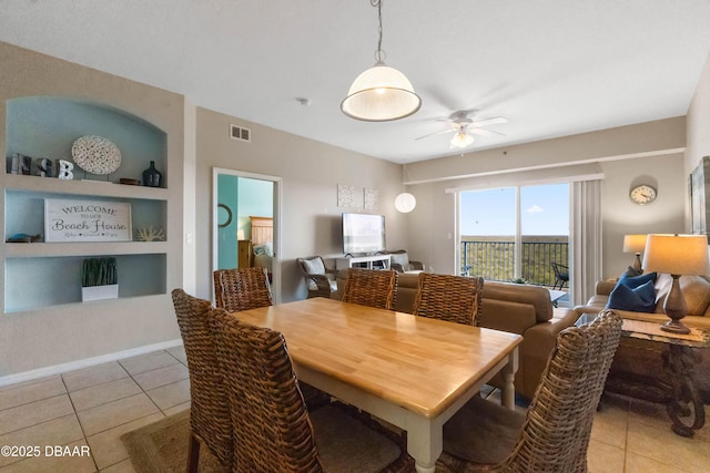 5300 S Atlantic Ave Unit 16-505, New Smyrna Beach, FL 32169 - dining area with light tile patterned floors, visible vents, built in shelves, and a ceiling fan