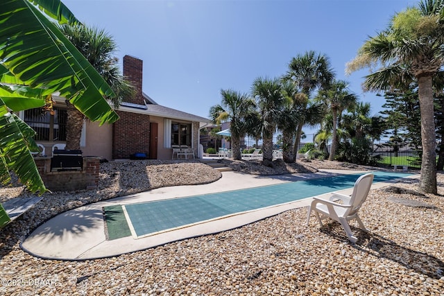 3370 Ocean Shore Blvd Unit 202B, Ormond Beach, FL 32176 - view of swimming pool with a patio area