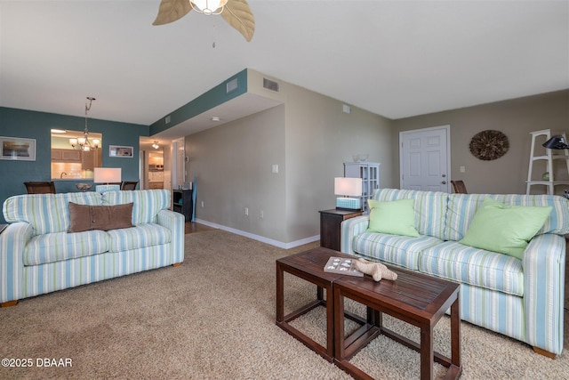 3370 Ocean Shore Blvd Unit 202B, Ormond Beach, FL 32176 - living area featuring light colored carpet, a chandelier, and ceiling fan