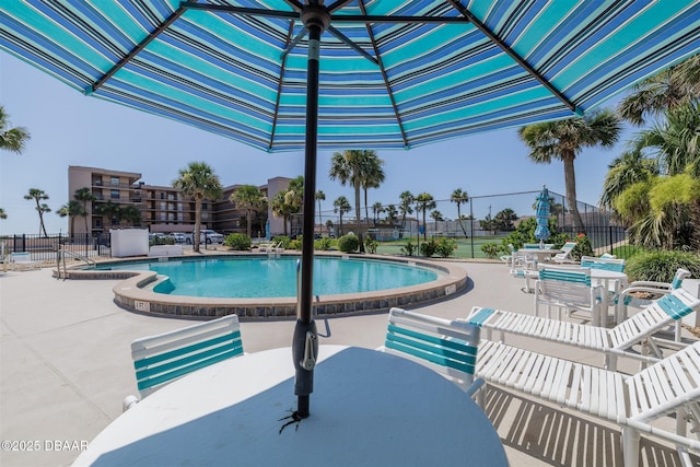 3370 Ocean Shore Blvd Unit 202B, Ormond Beach, FL 32176 - community pool featuring a patio and outdoor dining space