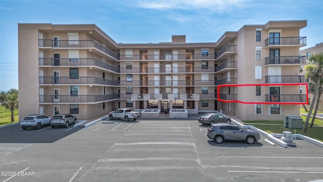 3370 Ocean Shore Blvd Unit 202B, Ormond Beach, FL 32176 - view of apartment building / complex featuring uncovered parking