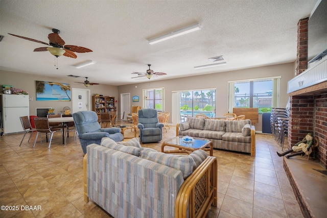 3370 Ocean Shore Blvd Unit 202B, Ormond Beach, FL 32176 - living area with ceiling fan, a textured ceiling, light tile patterned floors, and a fireplace
