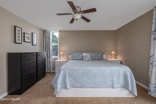 3370 Ocean Shore Blvd Unit 202B, Ormond Beach, FL 32176 - carpeted bedroom with baseboards and a ceiling fan