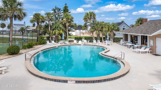 3370 Ocean Shore Blvd Unit 202B, Ormond Beach, FL 32176 - community pool with a patio area and a putting green