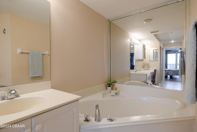 bathroom with a bathtub and vanity