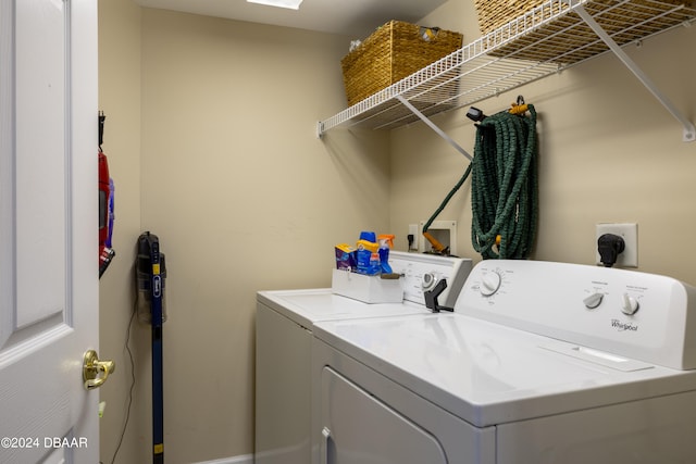 clothes washing area featuring washer and clothes dryer