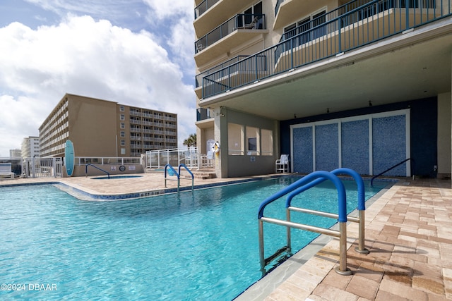 view of pool featuring a patio area