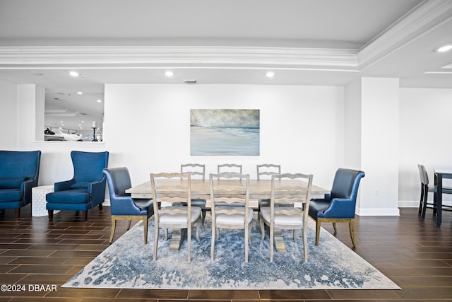 dining room featuring dark wood-type flooring and ornamental molding