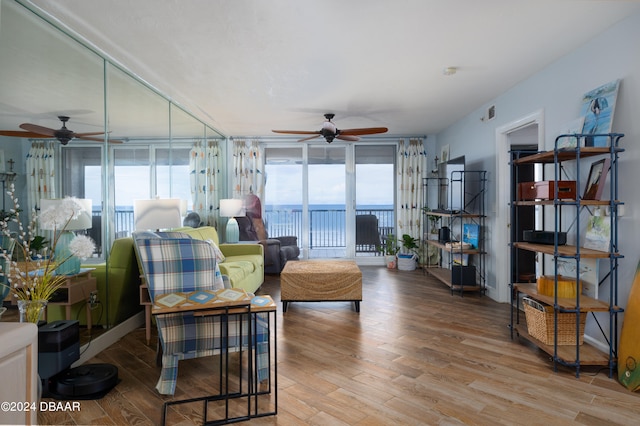 living room with hardwood / wood-style floors and ceiling fan